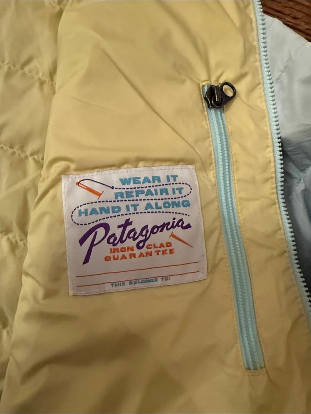 Patagonia Kids Light Gray Quilted Puffer Jacket, yellow inside.